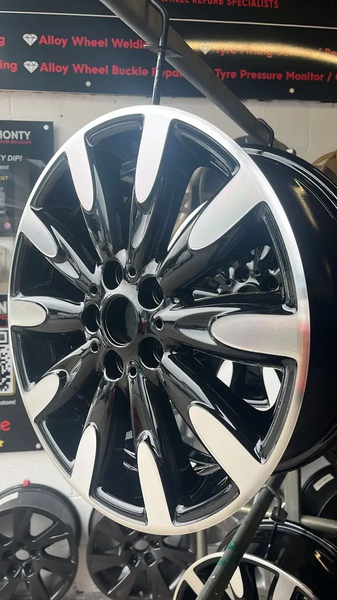 Corroded alloy wheel stripped and refinished by Dimonty Alloys, Wigan