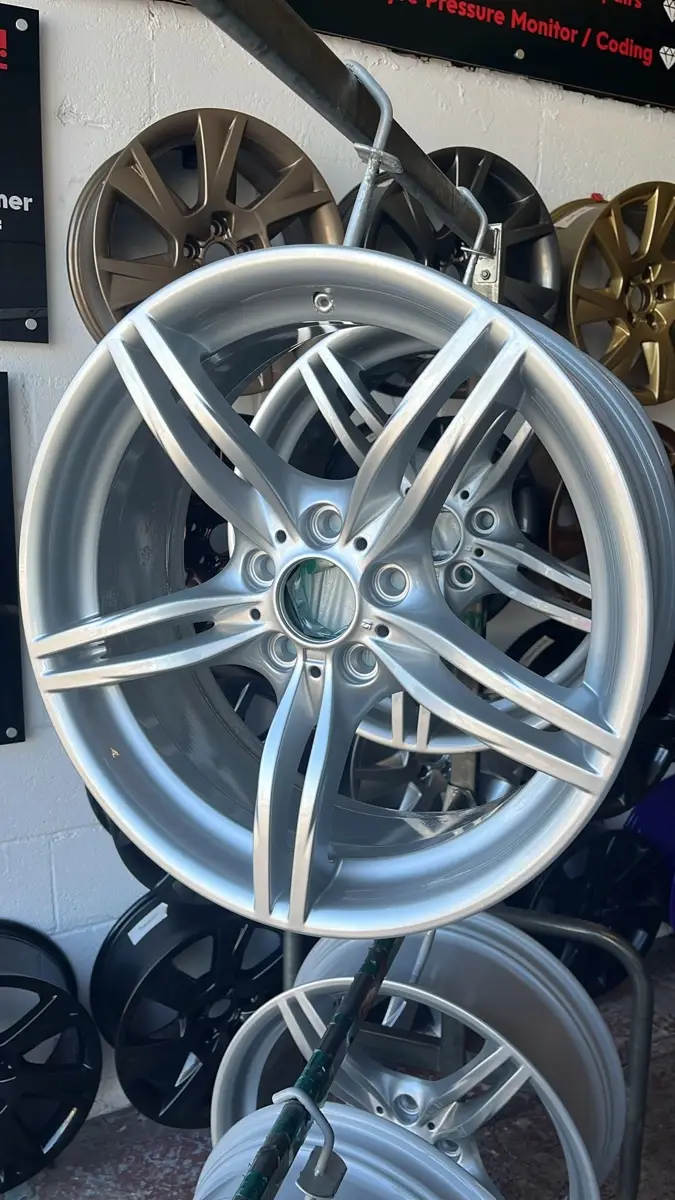 Corroded alloy wheel stripped and refinished by Dimonty Alloys, Wigan